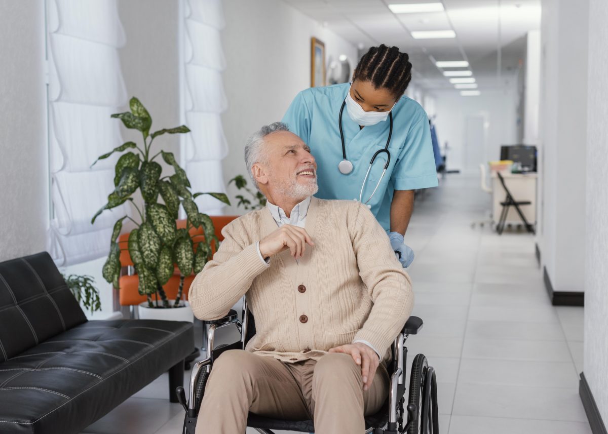 medium-shot-health-worker-helping-patient-1200x857.jpg